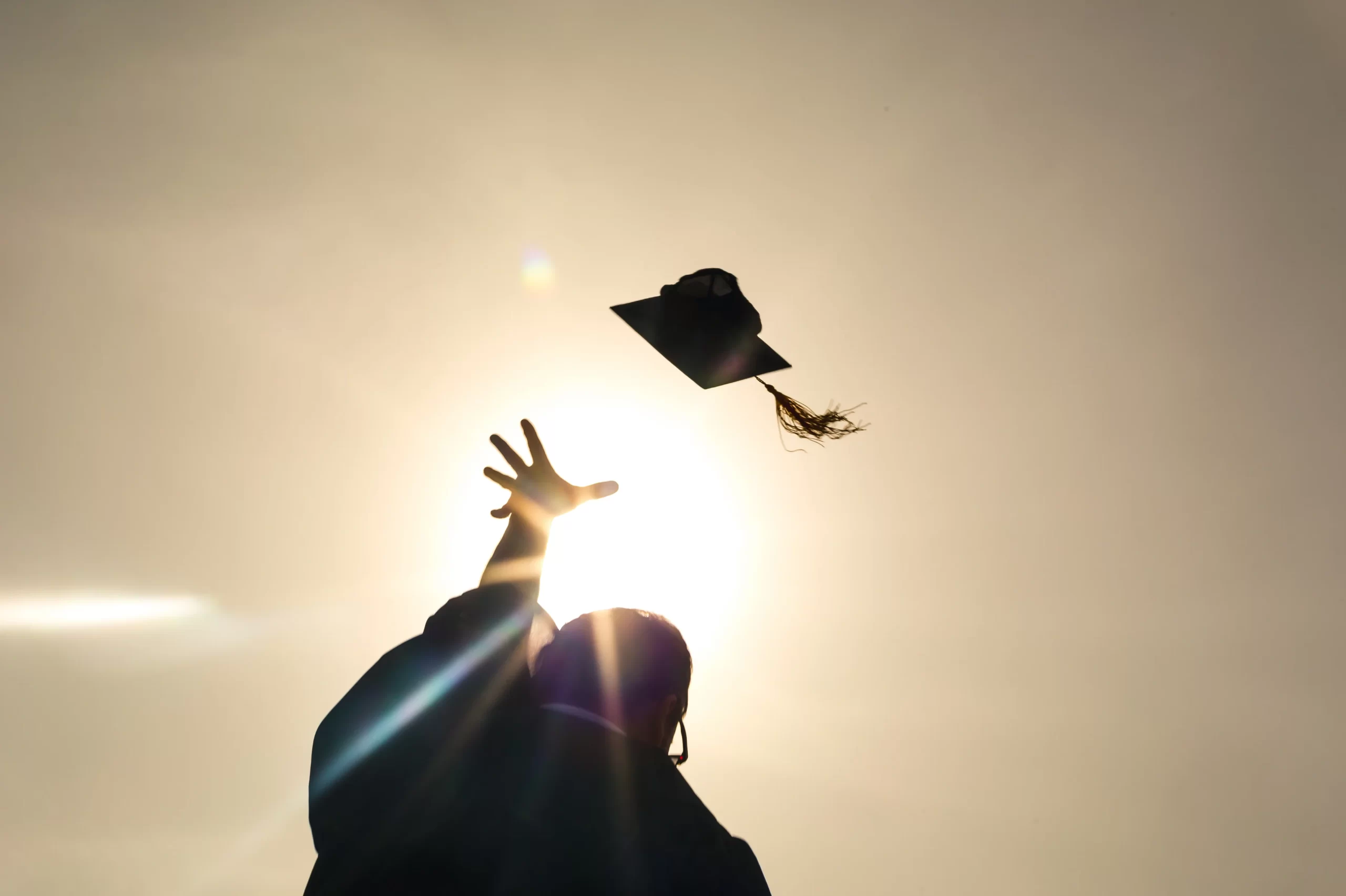 a graduate tossing cap