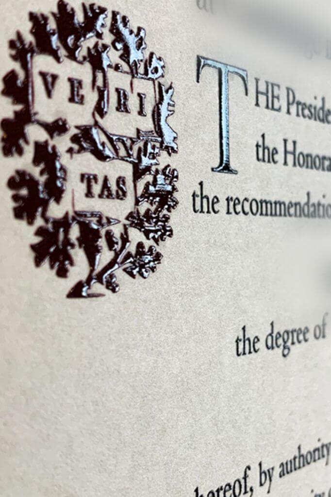 up close raised real university seal on degree document
